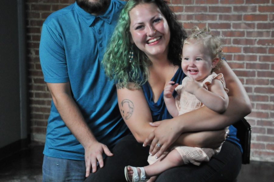 Young family smiling at the camera